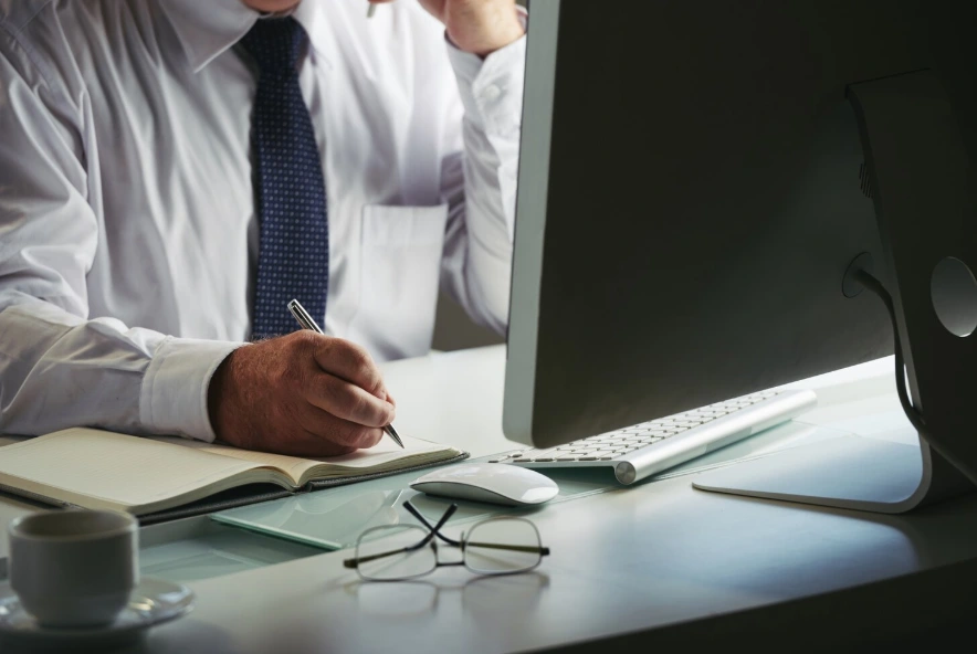 Man making notes in workplace